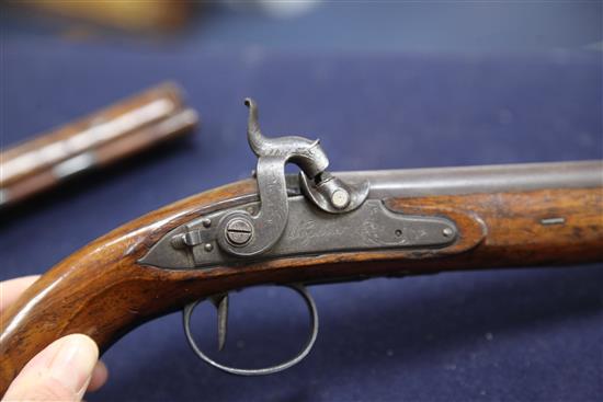 A pair of early 19th century percussion lock pistols, by Wogdon of London, 14in.